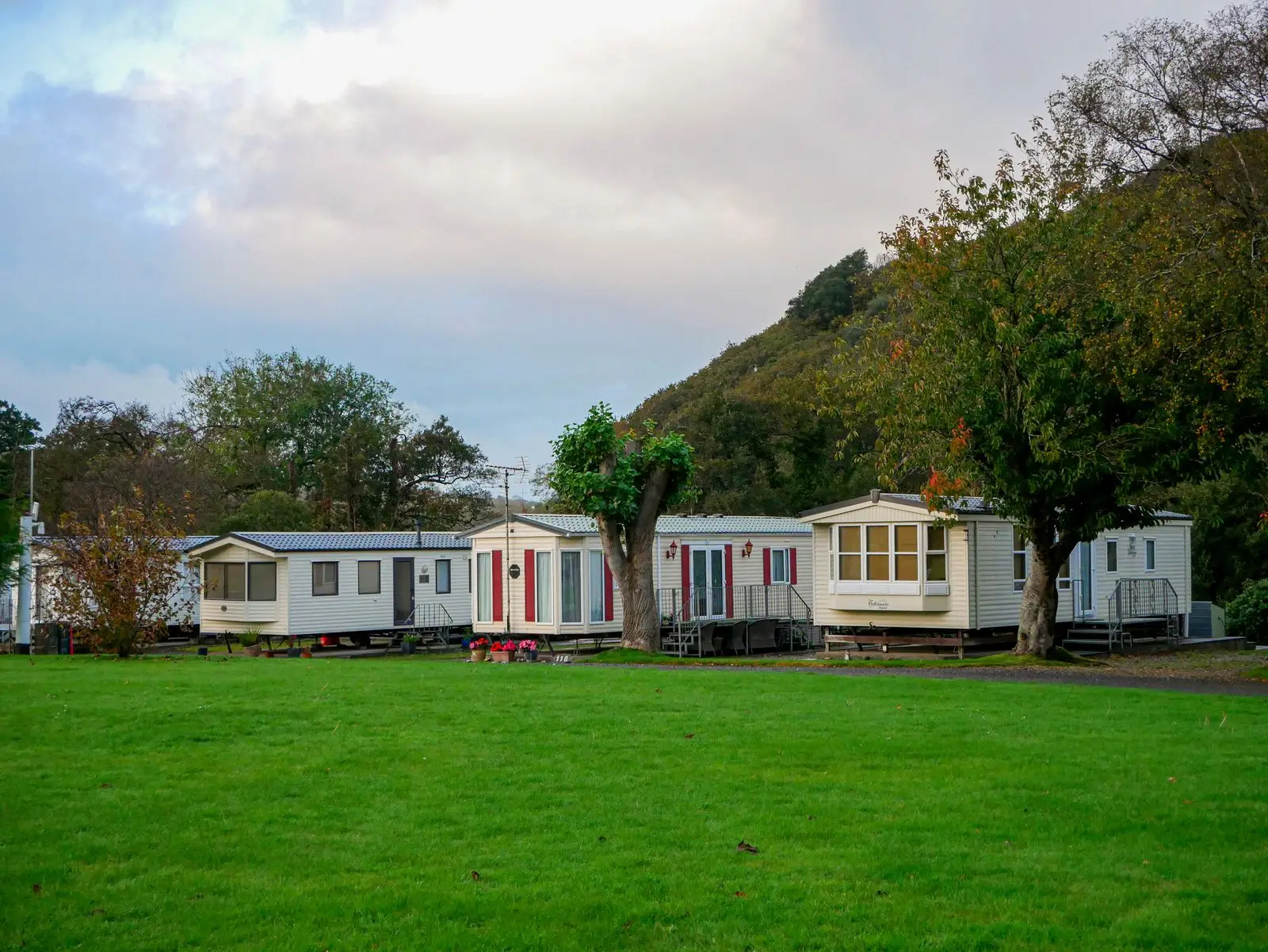 Row of mobile homes on a grassy lot
